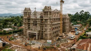 Church and institutional building under construction in Kenya, showing multi-storey structure and scaffolding